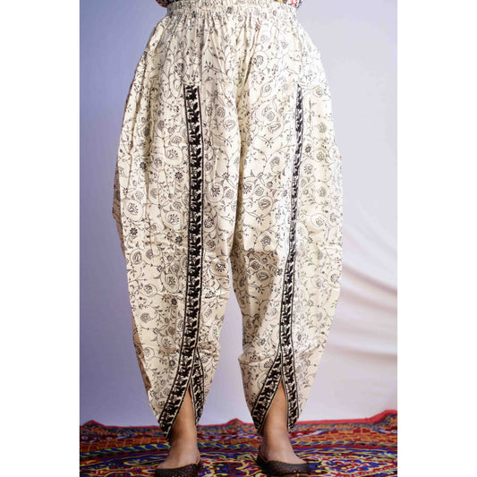 Floral-patterned harem pants on a plain background