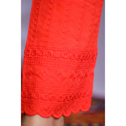 Close-up of a red lace garment with intricate patterns.