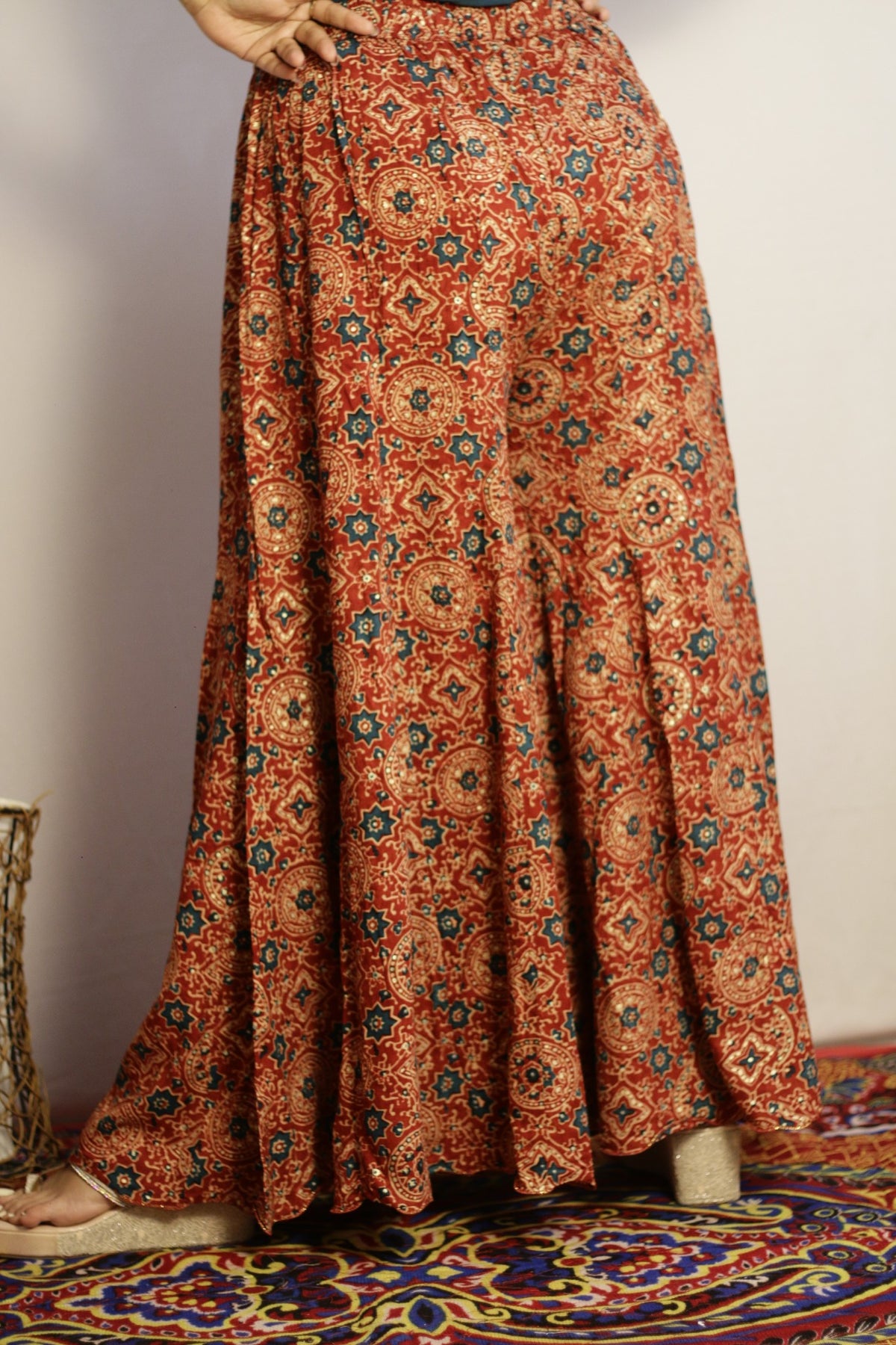 Rust rayon palazzo with medallion and star motifs in teal and cream