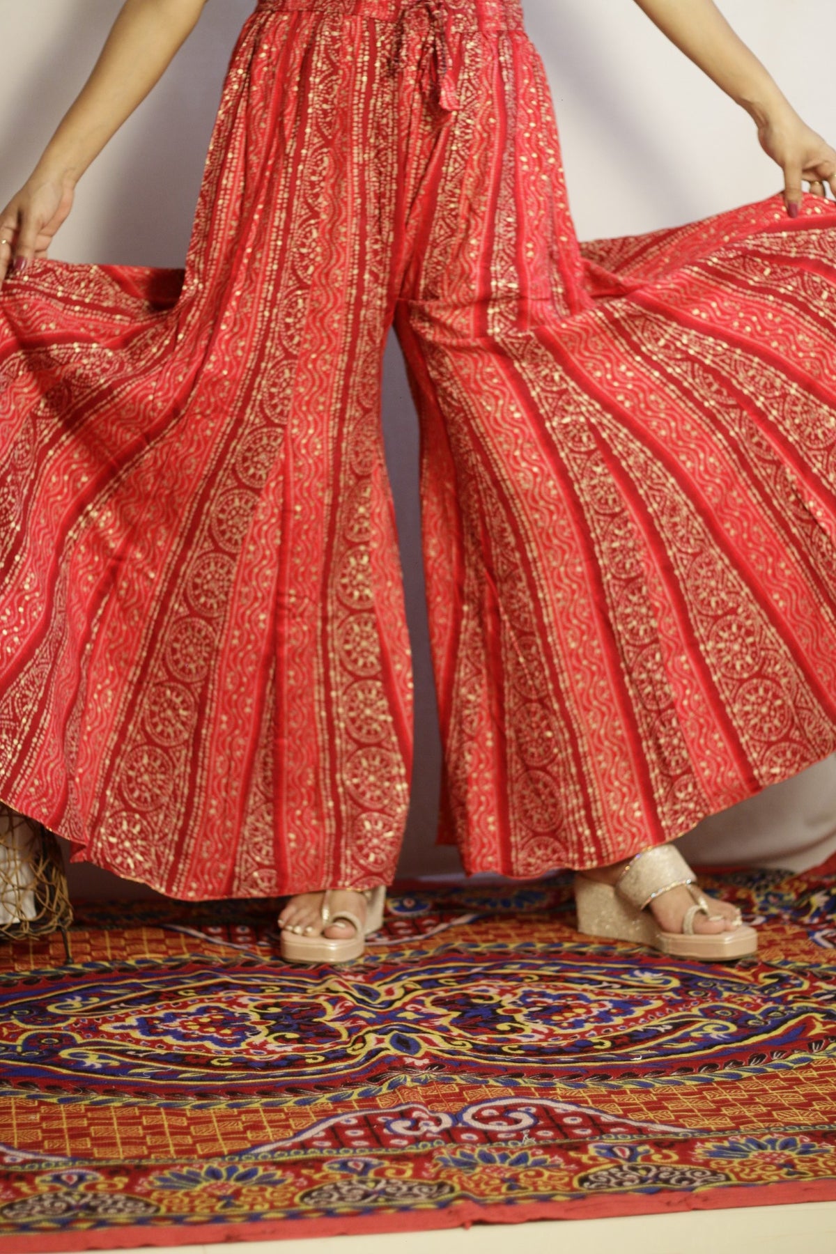 Pink kali palazzo in rayon, front view with gold bandhani style print